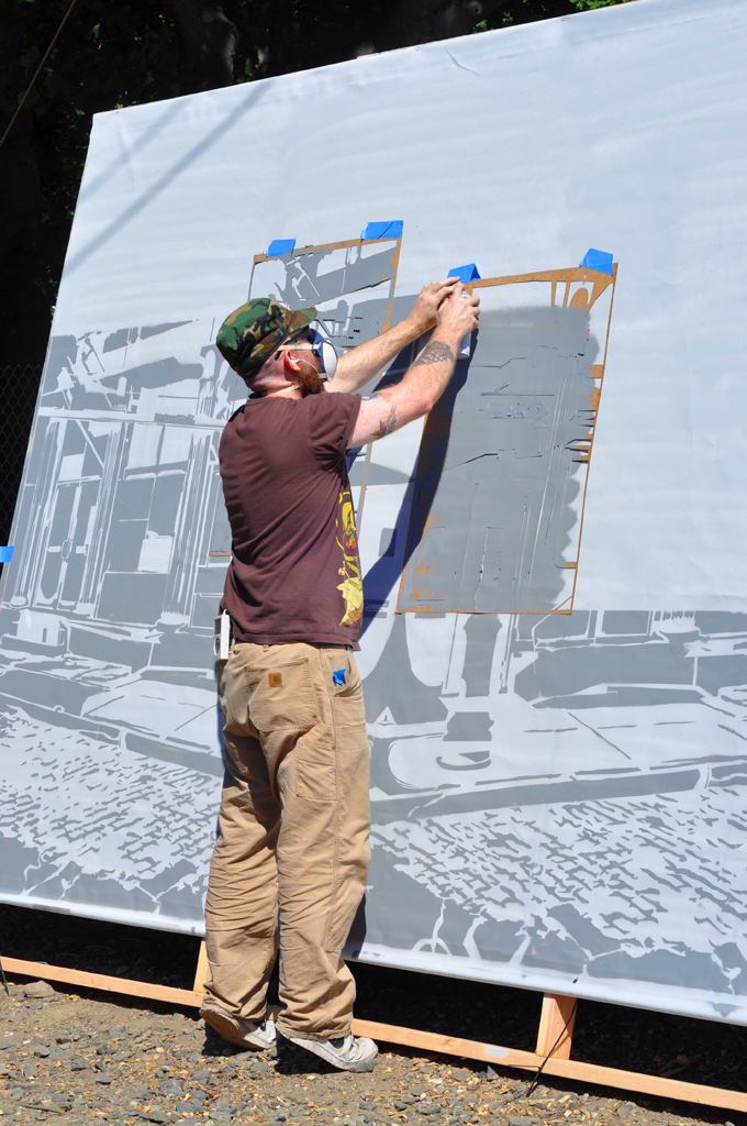 Logan Hicks at work on the mural he painted for the Electric Windows project in Beacon, New York in 2010. Photo by Jason Persse.