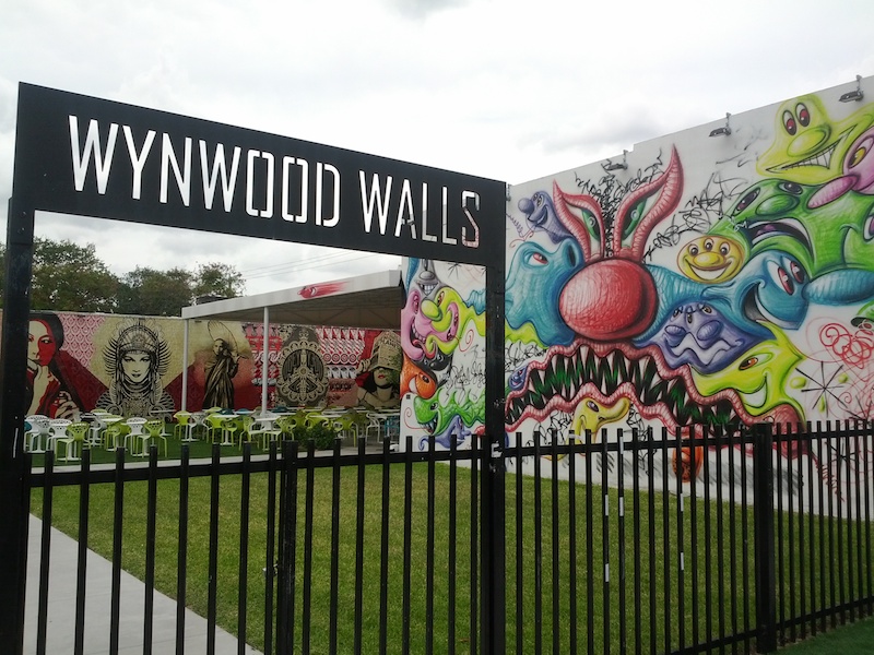 The entrance to Wynwood Walls in Wynwood, Miami with work by Kenny Scharf inside. Photo by Joe Anzalone.