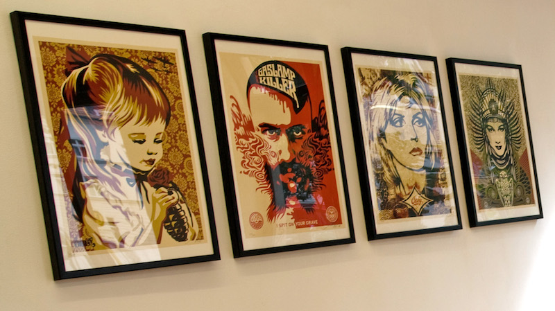 Four prints by Shepard Fairey. Original photo by Urbanartcore.eu, edited by RJ Rushmore.