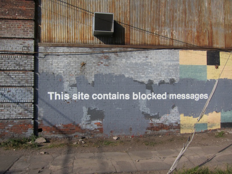 Banksy in Greenpoint, Brooklyn during his Better Out Than In project. Photo by Scott Lynch.